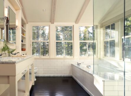 Bathroom featuring wood single hung windows.