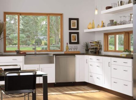 Glider windows featured in a kitchen over a sink and under cupboards.