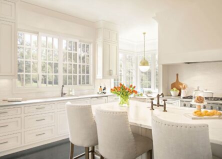 A kitchen featuring large glider windows.