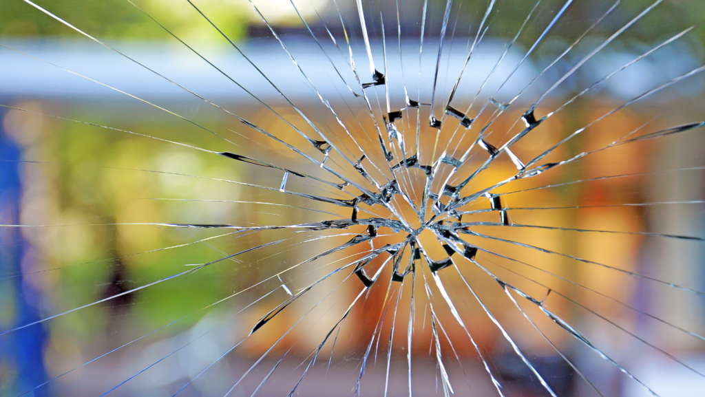 A close up of broken glass in a window.